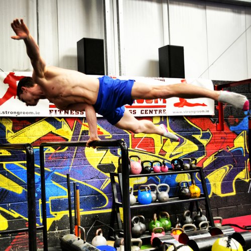 PCC Instructor, Adrian Harrington performs a 1 Arm Elbow Lever