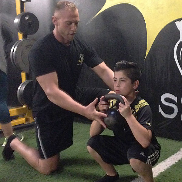 Benjamin Landry Coaching Youth Athlete Goblet Squat