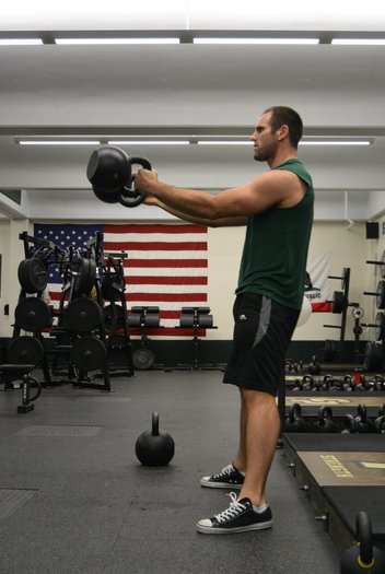 Chris Holder's training partner, Chris White swings two 32kg kettlebells