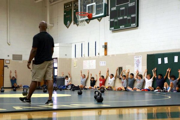 Darius Gilbert trains young athletes at a wrestling camp