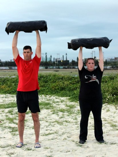 Faith and Dave Martin Ultimate Sandbag Overhead Press