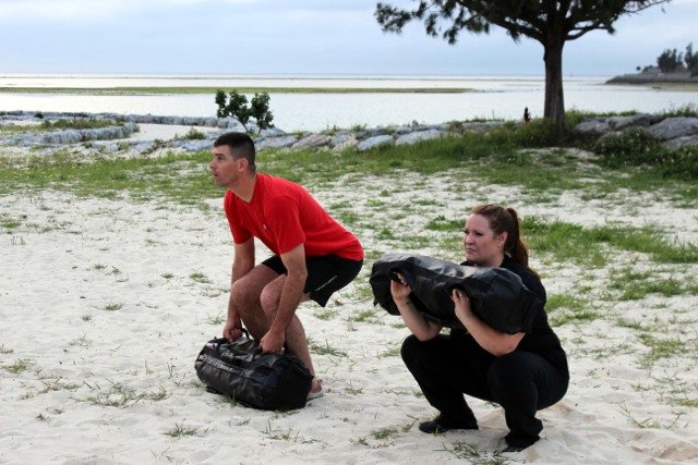 Faith and Dave Martin Ultimate Sandbag squats