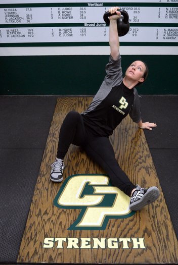 Jessie performs a kettlbell get-up at Cal Poly