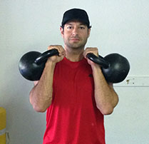 Jordan Rubin with two kettlebells double clean