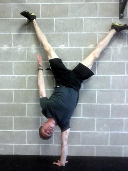 PCC Instructor Benji Williford Performs a 1 Arm Handstand