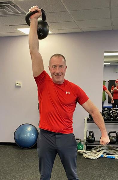 Brian McMaster, RKC Team Leader, performs a Kettlebell Military Press