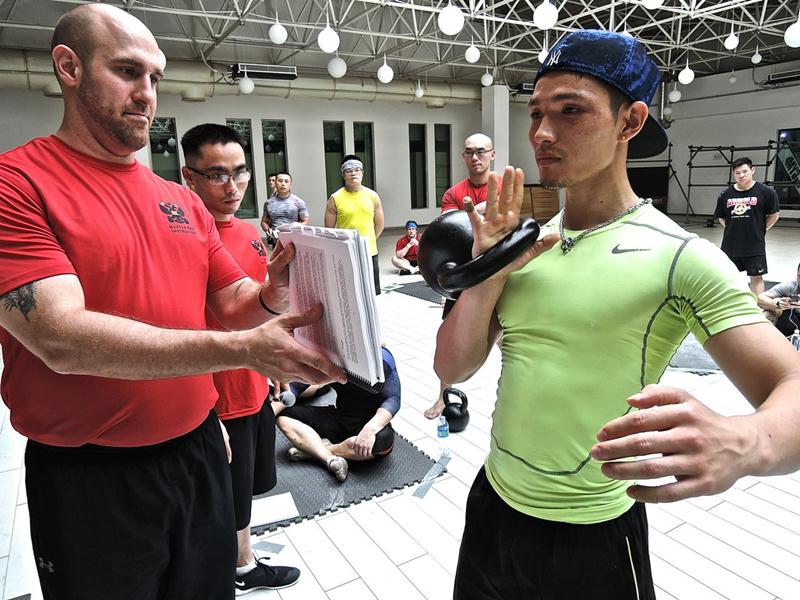 Master RKC Josh Henkin coaching kettlebell cleans at the first public RKC in China