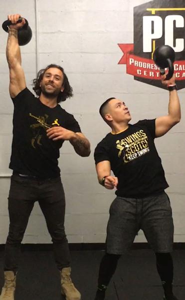 Joshua Teves and Angelo Grinceri with kettlebells