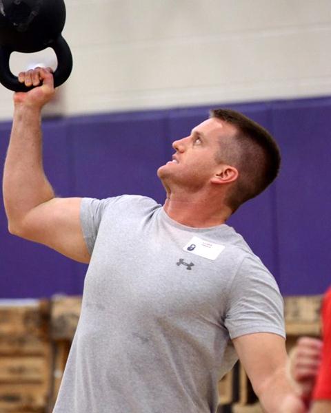 Assistant Olympic Strength and Conditioning Coach Luke Tipple Performs a Bottoms Up Kettlebell Press