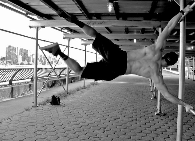 Nick Kenon at the East River demonstrating a Human Flag aka Press Flag