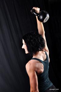 Adrienne Harvey, RKC pressing a kettlebell